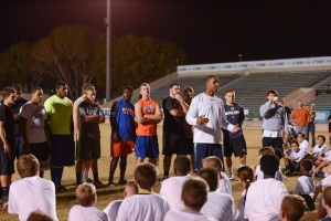 Dolphins alum Twan Russell addresses youth participants at the 2013 clinic - backed by some of the All Star Classic players.